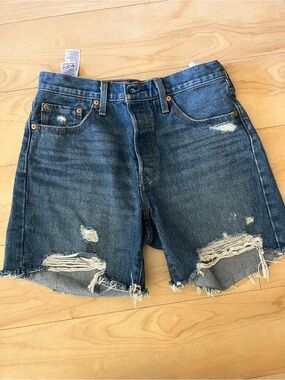 Classic Levi’s 501 Original denim shorts in a medium blue wash. High-rise fit